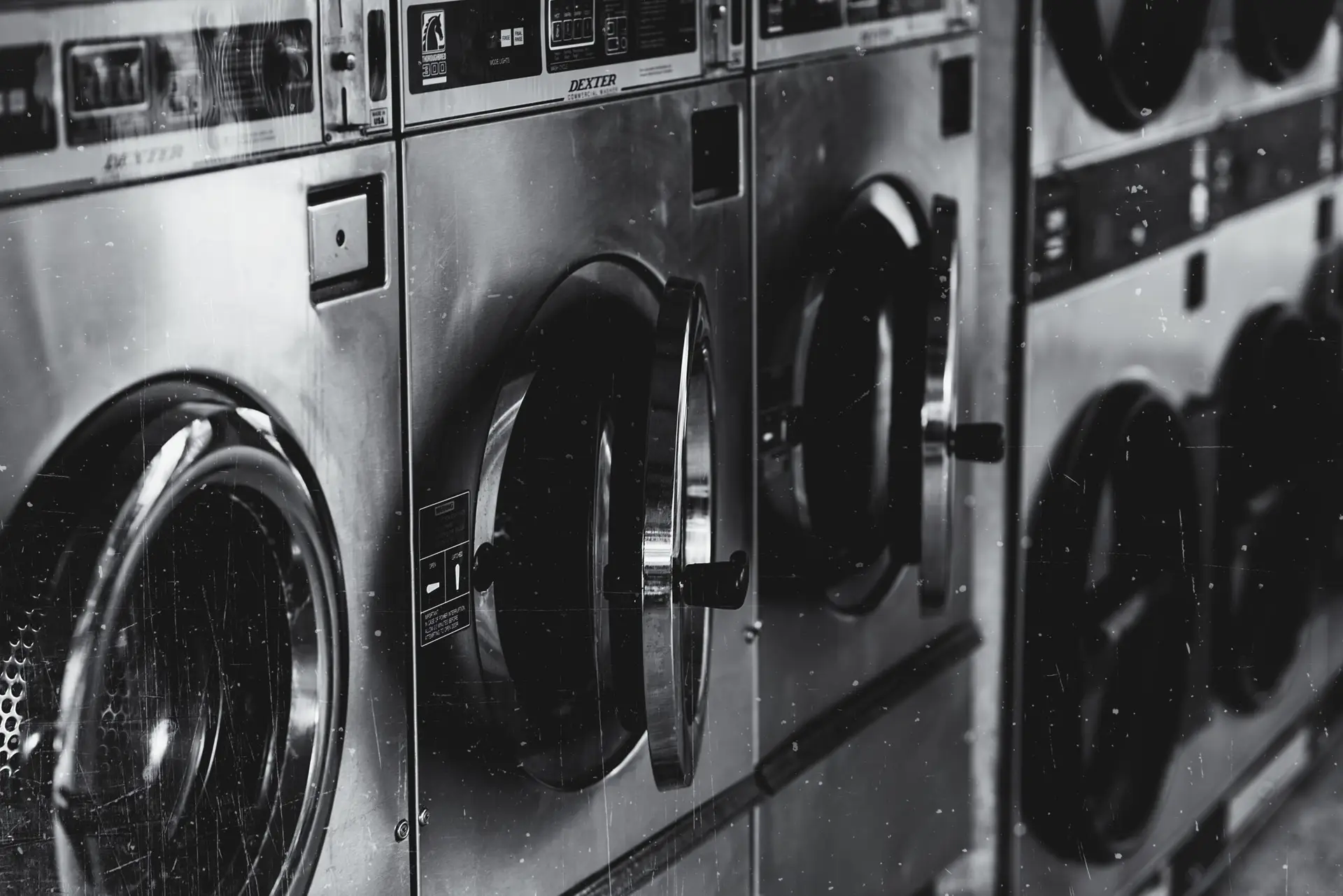 grayscale shot washing machine with opened doors scaled